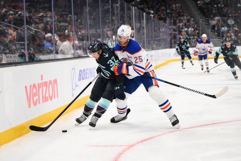 Oct 2, 2024; Seattle, Washington, USA; Seattle Kraken center Yanni Gourde (37) protects the puck from Edmonton Oilers defenseman Darnell Nurse (25) during the third period at Climate Pledge Arena. Mandatory Credit: Steven Bisig-Imagn Images