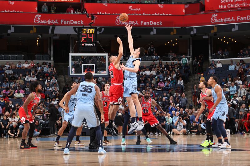 MEMPHIS, TN - OCTOBER 28: Nikola Vucevic #9 of the Chicago Bulls and Zach Edey #14 of the Memphis Grizzlies take tip off during the game on October 28, 2024 at FedExForum in Memphis, Tennessee. NOTE TO USER: User expressly acknowledges and agrees that, by downloading and or using this photograph, User is consenting to the terms and conditions of the Getty Images License Agreement. Mandatory Copyright Notice: Copyright 2024 NBAE (Photo by Joe Murphy/NBAE via Getty Images)