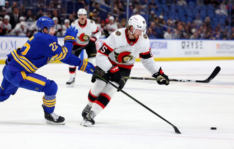 Nov 5, 2024; Buffalo, New York, USA;  Buffalo Sabres right wing Jack Quinn (22) and Ottawa Senators defenseman Jake Sanderson (85) go after a loose puck during the first period at KeyBank Center. Mandatory Credit: Timothy T. Ludwig-Imagn Images