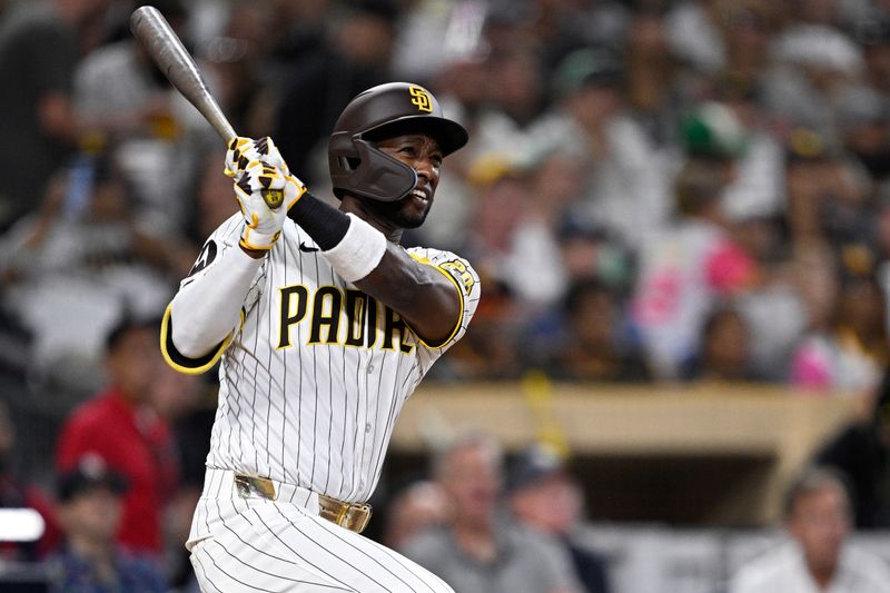 Jun 25, 2024; San Diego, California, USA; San Diego Padres left fielder Jurickson Profar (10) hits a grand slam home run against the Washington Nationals during the sixth inning at Petco Park. Mandatory Credit: Orlando Ramirez-USA TODAY Sports