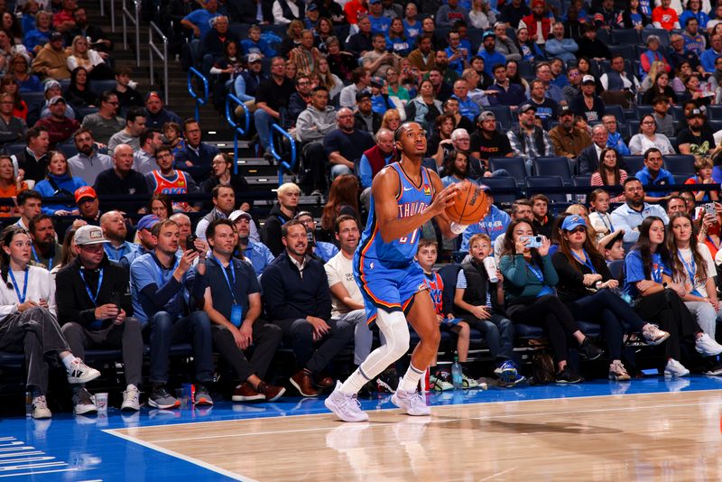 OKLAHOMA CITY, OK - NOVEMBER 13:  Aaron Wiggins #21 of the Oklahoma City Thunder handles the ball during the game against the New Orleans Pelicans on November 13, 2024 at Paycom Center in Oklahoma City, Oklahoma. NOTE TO USER: User expressly acknowledges and agrees that, by downloading and or using this photograph, User is consenting to the terms and conditions of the Getty Images License Agreement. Mandatory Copyright Notice: Copyright 2024 NBAE (Photo by Zach Beeker/NBAE via Getty Images)