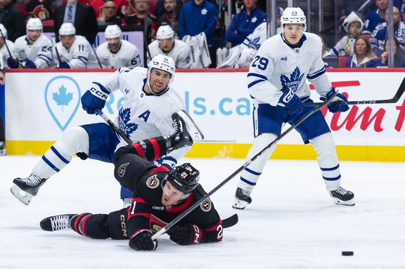 Apr 26, 2025; Ottawa, Ontario, CAN; Ottawa Senators center Nick Cousins (21) is taken down by Toronto Maple Leafs center John Tavares (91) in game four of the first round of the 2025 Stanley Cup Playoffs at Canadian Tire Centre. Mandatory Credit: Marc DesRosiers-Imagn Images