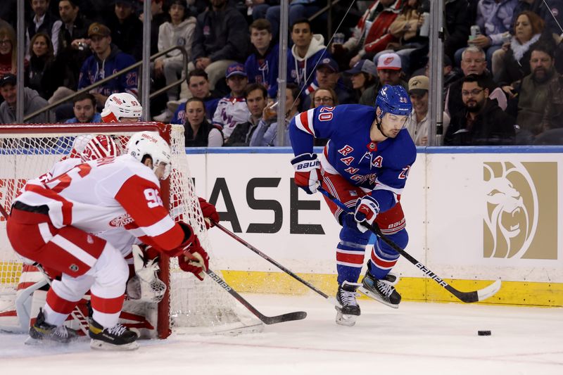 Nov 29, 2023; New York, New York, USA; New York Rangers left wing Chris Kreider (20) plays the puck against Detroit Red Wings defenseman Jake Walman (96) and goaltender Ville Husso (35) during the first period at Madison Square Garden. Mandatory Credit: Brad Penner-USA TODAY Sports