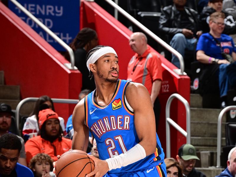 DETROIT, MI - JANUARY 28: Aaron Wiggins #21 of the Oklahoma City Thunder handles the ball during the game against the Detroit Pistons on January 28, 2024 at Little Caesars Arena in Detroit, Michigan. NOTE TO USER: User expressly acknowledges and agrees that, by downloading and/or using this photograph, User is consenting to the terms and conditions of the Getty Images License Agreement. Mandatory Copyright Notice: Copyright 2024 NBAE (Photo by Chris Schwegler/NBAE via Getty Images)