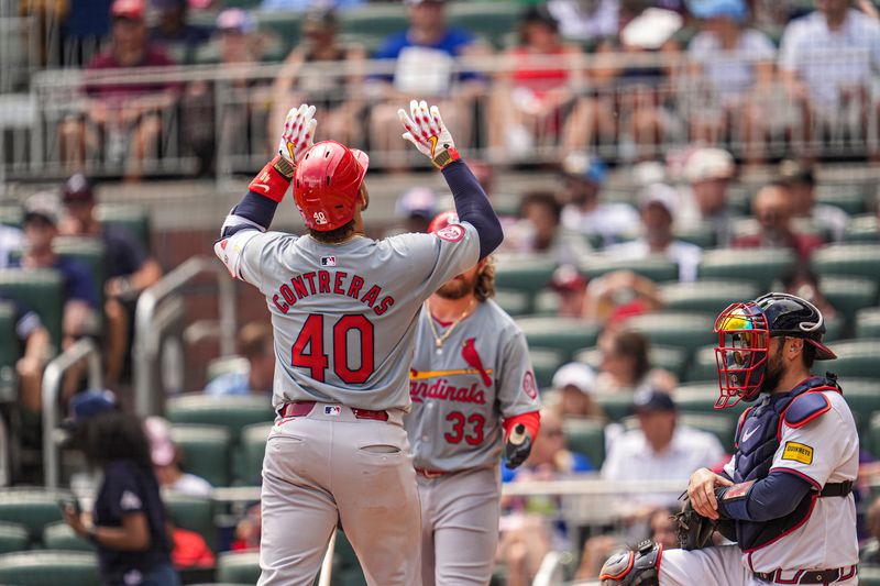 Jul 21, 2024; Cumberland, Georgia, USA; St. Louis Cardinals catcher Willson Contreras (40) reacts after hitting a home run against the Atlanta Braves during the eighth inning at Truist Park. Mandatory Credit: Dale Zanine-USA TODAY Sports