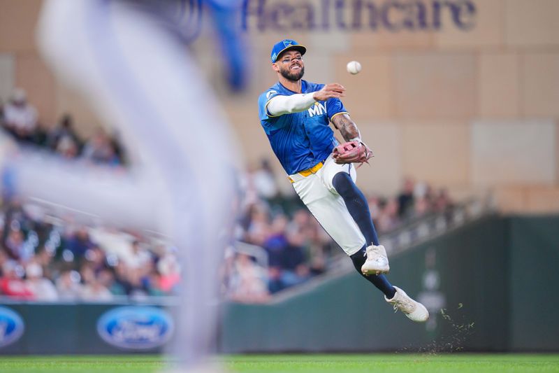 May 23, 2025; Minneapolis, Minnesota, USA; Minnesota Twins shortstop Carlos Correa (4) throws to first base against the Kansas City Royals in the eighth inning at Target Field. Mandatory Credit: Brad Rempel-Imagn Images