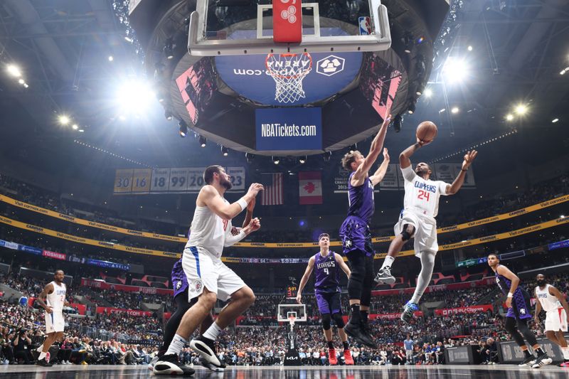 LOS ANGELES, CA - FEBRUARY 25: Norman Powell #24 of the LA Clippers shoots the ball during the game against the Sacramento Kings on February 25, 2024 at Crypto.Com Arena in Los Angeles, California. NOTE TO USER: User expressly acknowledges and agrees that, by downloading and/or using this Photograph, user is consenting to the terms and conditions of the Getty Images License Agreement. Mandatory Copyright Notice: Copyright 2024 NBAE (Photo by Adam Pantozzi/NBAE via Getty Images)