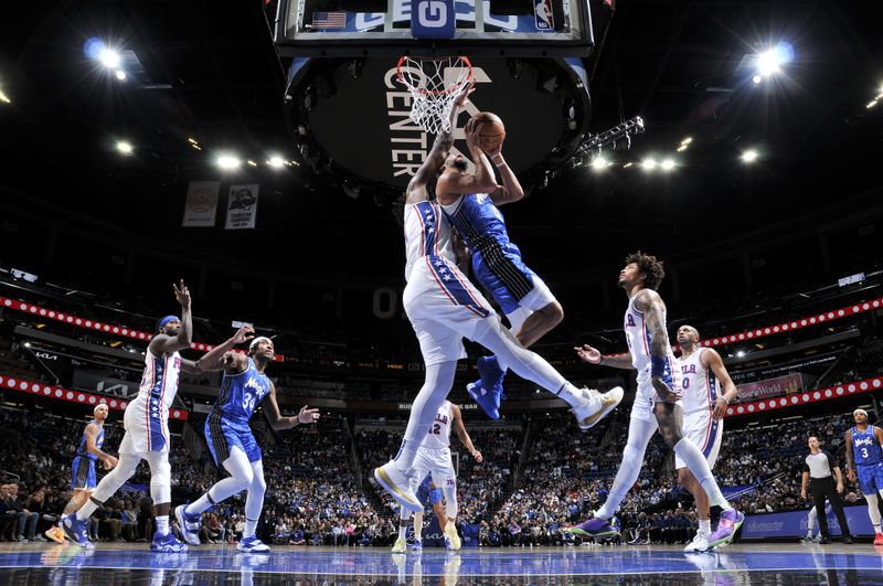 ORLANDO, FL - JANUARY 19: Jalen Suggs #4 of the Orlando Magic drives to the basket during the game against the Philadelphia 76ers on January 19, 2024 at the Kia Center in Orlando, Florida. NOTE TO USER: User expressly acknowledges and agrees that, by downloading and or using this photograph, User is consenting to the terms and conditions of the Getty Images License Agreement. Mandatory Copyright Notice: Copyright 2024 NBAE (Photo by Fernando Medina/NBAE via Getty Images)