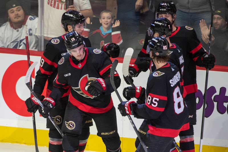 Nov 4, 2023; Ottawa, Ontario, CAN; Ottawa Senators right wing Drake Batherson (19) celebrates with team his goal scored in the third period against the Tampa Bay Lightning at the Canadian Tire Centre. Mandatory Credit: Marc DesRosiers-USA TODAY Sports