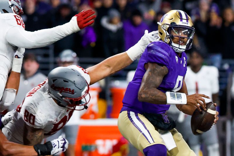 Nov 25, 2023; Seattle, Washington, USA; Washington Huskies quarterback Michael Penix Jr. (9) passes against the Washington State Cougars during the fourth quarter at Alaska Airlines Field at Husky Stadium. Mandatory Credit: Joe Nicholson-USA TODAY Sports