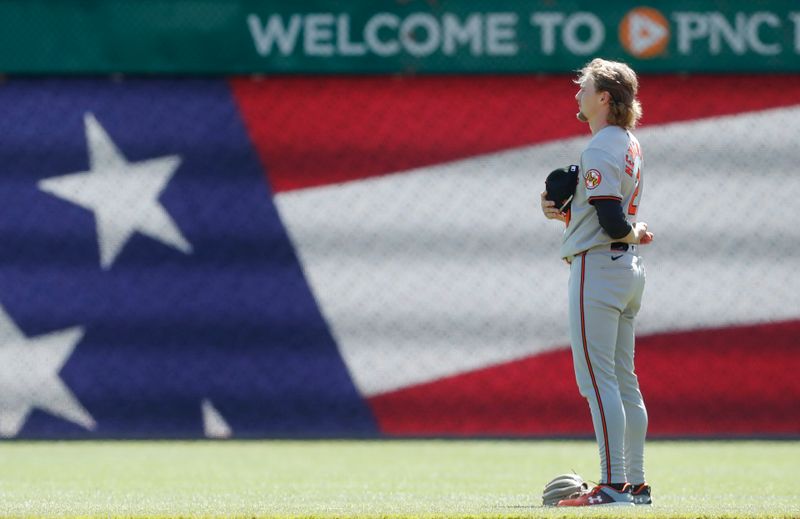 Apr 7, 2024; Pittsburgh, Pennsylvania, USA; Baltimore Orioles shortstop Gunnar Henderson (2) stands for the national anthem against the Pittsburgh Pirates at PNC Park. Mandatory Credit: Charles LeClaire-USA TODAY Sports