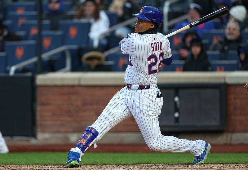 Apr 8, 2025; New York City, New York, USA; New York Mets right fielder Juan Soto (22) singles during the seventh inning against the Miami Marlins at Citi Field. Mandatory Credit: Vincent Carchietta-Imagn Images