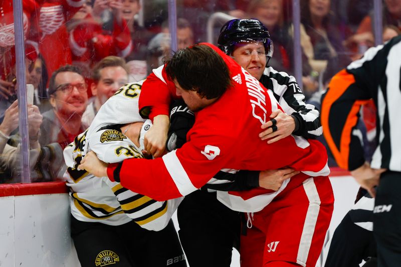 Dec 31, 2023; Detroit, Michigan, USA; Detroit Red Wings defenseman Ben Chiarot (8) scuffles with Boston Bruins center Morgan Geekie (39) while linesman Derek Amell (75) tries to separate them during the first period of the game between the Boston Bruins and the Detroit Red Wings at Little Caesars Arena. Mandatory Credit: Brian Bradshaw Sevald-USA TODAY Sports