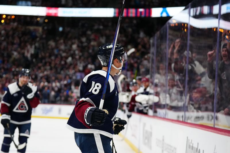 Feb 28, 2025; Denver, Colorado, USA; Colorado Avalanche center Jack Drury (18) celebrates his goal towards the fans in the second period against the Minnesota Wild at Ball Arena. Mandatory Credit: Ron Chenoy-Imagn Images