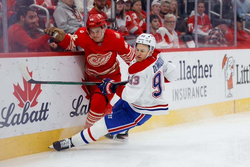 Oct 9, 2025; Detroit, Michigan, USA;  Detroit Red Wings defenseman Axel Sandin-Pellikka (44) and Montréal Canadiens right wing Ivan Demidov (93) battle for the puck in the first period at Little Caesars Arena. Mandatory Credit: Rick Osentoski-Imagn Images