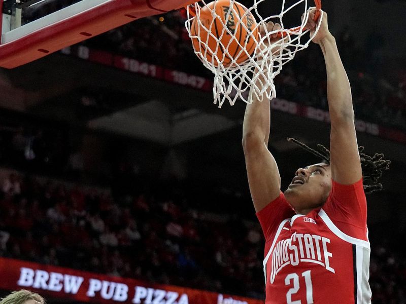 Feb 13, 2024; Madison, Wisconsin, USA; Ohio State Buckeyes forward Devin Royal (21) dunks the ball during the first half against the Wisconsin Badgers at the Kohl Center. Mandatory Credit: Mark Hoffman-USA TODAY Sports