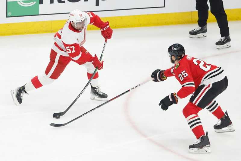 Feb 25, 2024; Chicago, Illinois, USA; Detroit Red Wings left wing David Perron (57) shoots against Chicago Blackhawks defenseman Jarred Tinordi (25) during the first period at United Center. Mandatory Credit: Kamil Krzaczynski-USA TODAY Sports