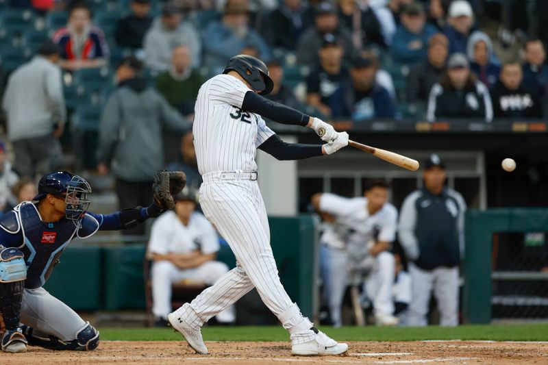 Apr 28, 2023; Chicago, Illinois, USA; Chicago White Sox designated hitter Gavin Sheets (32) singles against the Tampa Bay Rays during the fourth inning at Guaranteed Rate Field. Mandatory Credit: Kamil Krzaczynski-USA TODAY Sports