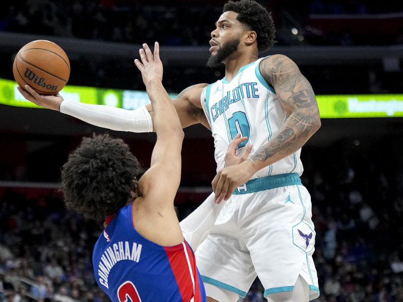 DETROIT, MICHIGAN - FEBRUARY 09: Miles Bridges #0 of the Charlotte Hornets shoots the ball against Cade Cunningham #2 of the Detroit Pistons during the first quarter at Little Caesars Arena on February 09, 2025 in Detroit, Michigan. NOTE TO USER: User expressly acknowledges and agrees that, by downloading and or using this photograph, User is consenting to the terms and conditions of the Getty Images License Agreement. (Photo by Nic Antaya/Getty Images)