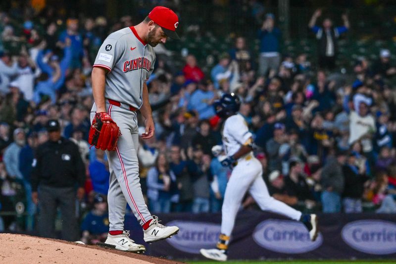 Apr 6, 2025; Milwaukee, Wisconsin, USA;  Cincinnati Reds pitcher Sam Moll (50) reacts after giving up a 3-run home run to Milwaukee Brewers left fielder Jackson Chourio (11) in the fourth inning at American Family Field. Mandatory Credit: Benny Sieu-Imagn Images