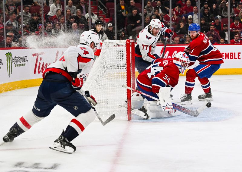 Oct 21, 2023; Montreal, Quebec, CAN; Montreal Canadiens goalie Jake Allen (34) makes a save against Washington Capitals right wing T.J. Oshie (77) during the third period at Bell Centre. Mandatory Credit: David Kirouac-USA TODAY Sports