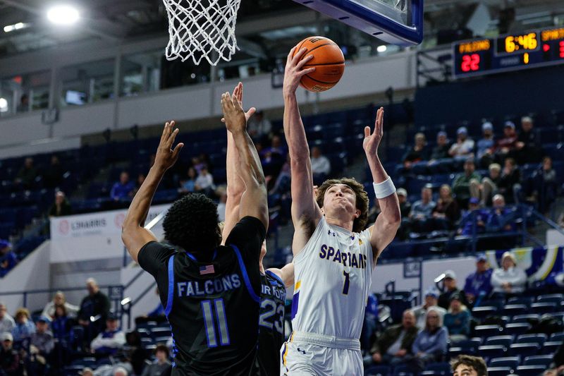 Jan 13, 2024; Colorado Springs, Colorado, USA; San Jose State Spartans guard Garrett Anderson (1) drives to the net against Air Force Falcons guard Kellan Boylan (23) and guard Byron Brown (11) in the first half at Clune Arena. Mandatory Credit: Isaiah J. Downing-USA TODAY Sports