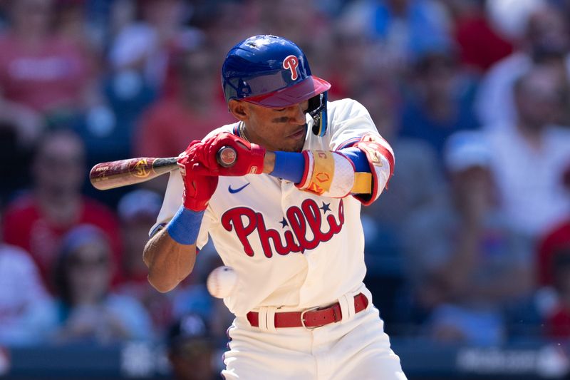 Aug 13, 2023; Philadelphia, Pennsylvania, USA; Philadelphia Phillies center fielder Johan Rojas (18) is hit by a pitch during the seventh inning against the Minnesota Twins at Citizens Bank Park. Mandatory Credit: Bill Streicher-USA TODAY Sports