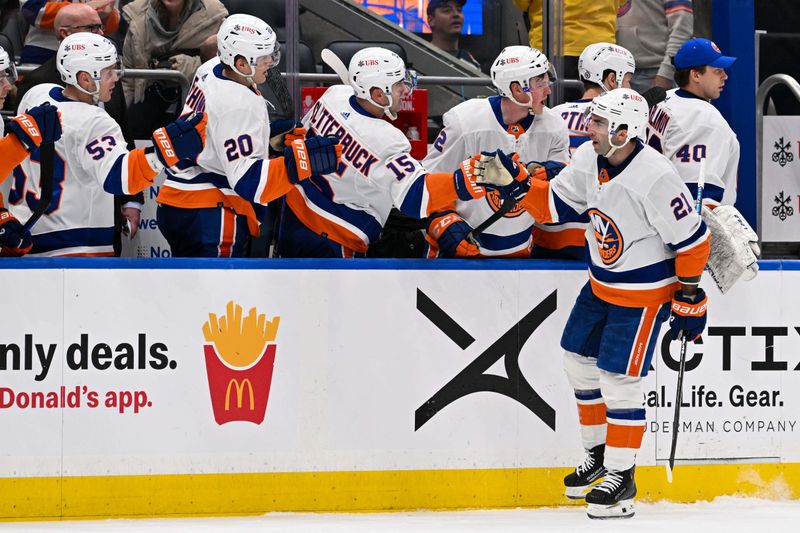 Mar 19, 2024; Elmont, New York, USA; New York Islanders center Kyle Palmieri (21) celebrates his goal against the Carolina Hurricanes with the New York Islanders bench during the third period at UBS Arena. Mandatory Credit: Dennis Schneidler-USA TODAY Sports