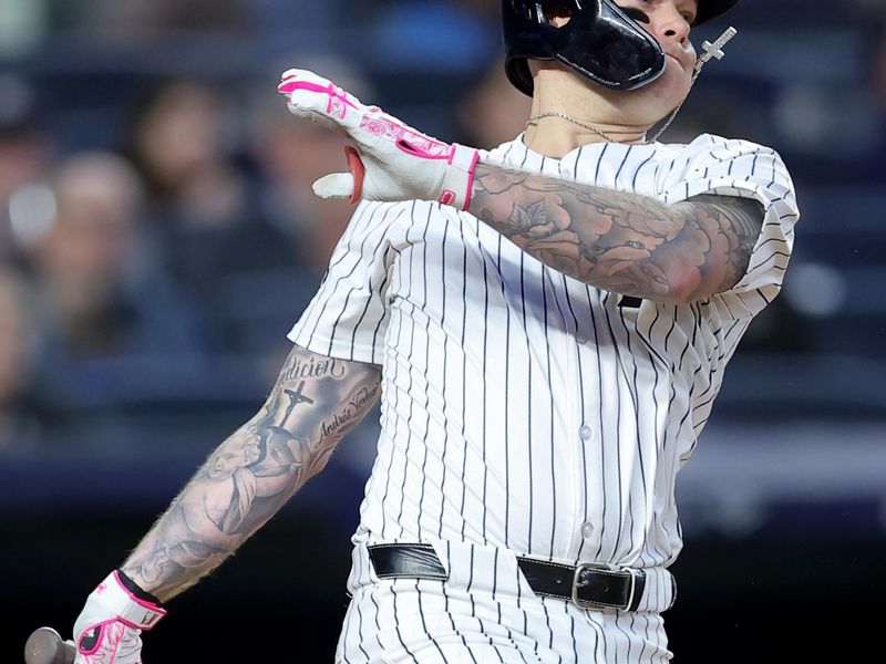 May 20, 2024; Bronx, New York, USA; New York Yankees left fielder Alex Verdugo (24) follows through on an RBI single against the Seattle Mariners during the fifth inning at Yankee Stadium. Mandatory Credit: Brad Penner-USA TODAY Sports