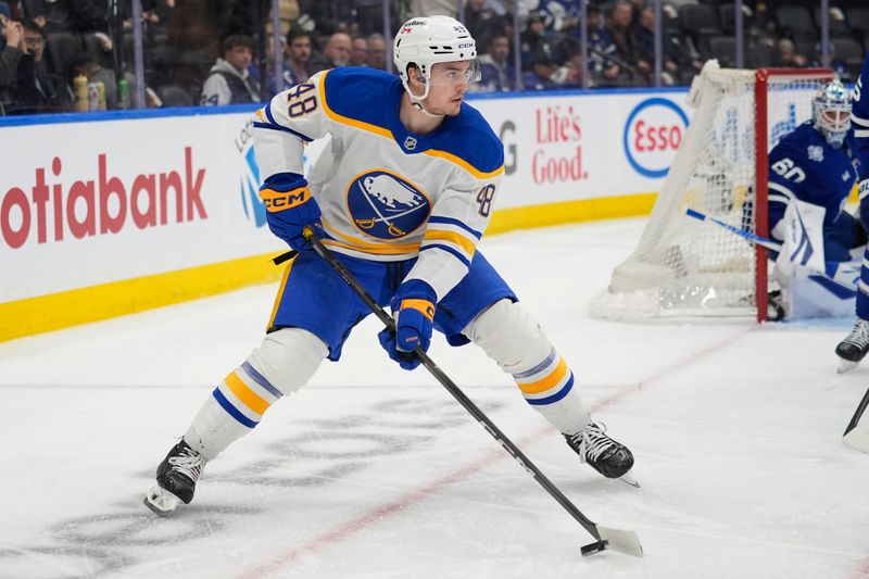 Jan 27, 2026; Toronto, Ontario, CAN; Buffalo Sabres forward Tyson Kozak (48) carries the puck against the Toronto Maple Leafs during the second period at Scotiabank Arena. Mandatory Credit: John E. Sokolowski-Imagn Images