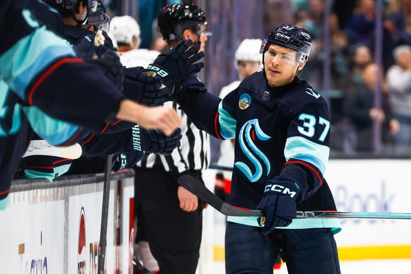 Jan 4, 2024; Seattle, Washington, USA; Seattle Kraken center Yanni Gourde (37) celebrates after scoring a goal against the Ottawa Senators during the first period at Climate Pledge Arena. Mandatory Credit: Joe Nicholson-USA TODAY Sports