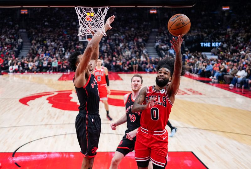 TORONTO, ON - JANUARY 31: Coby White #0 of the Chicago Bulls goes to the basket against Scottie Barnes #4 of the Toronto Raptors during the first half of their basketball game at the Scotiabank Arena on January 31, 2025 in Toronto, Ontario, Canada. NOTE TO USER: User expressly acknowledges and agrees that, by downloading and/or using this Photograph, user is consenting to the terms and conditions of the Getty Images License Agreement. (Photo by Mark Blinch/Getty Images)