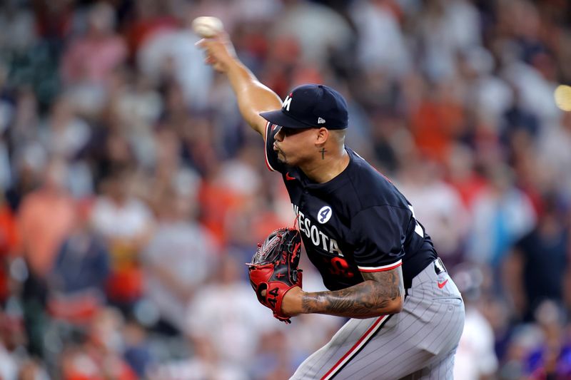 Jun 2, 2024; Houston, Texas, USA; Minnesota Twins relief pitcher Jhoan Duran (59) delivers a pitch against the Houston Astros during the ninth inning at Minute Maid Park. Mandatory Credit: Erik Williams-USA TODAY Sports