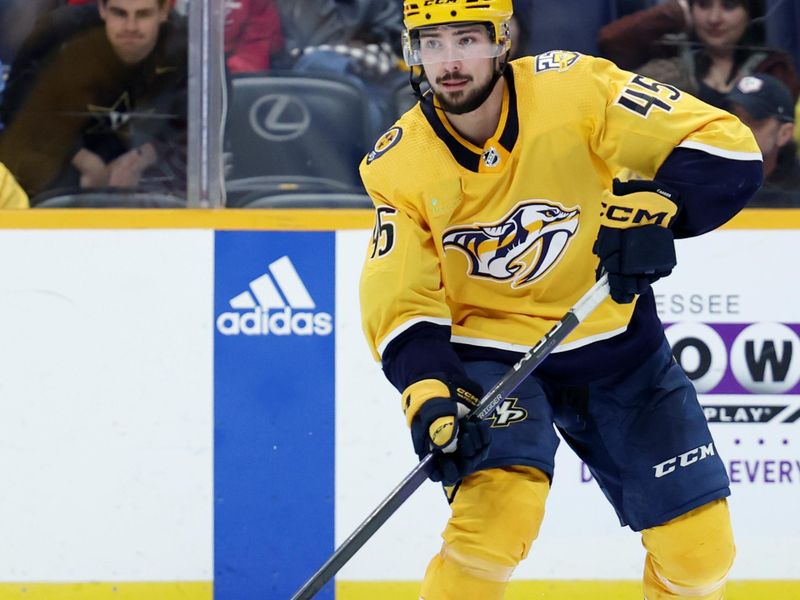 Mar 7, 2024; Nashville, Tennessee, USA; Nashville Predators defenseman Alexandre Carrier (45) passes the puck during their game against the Buffalo Sabres at Bridgestone Arena. Mandatory Credit: Alan Poizner-USA TODAY Sports