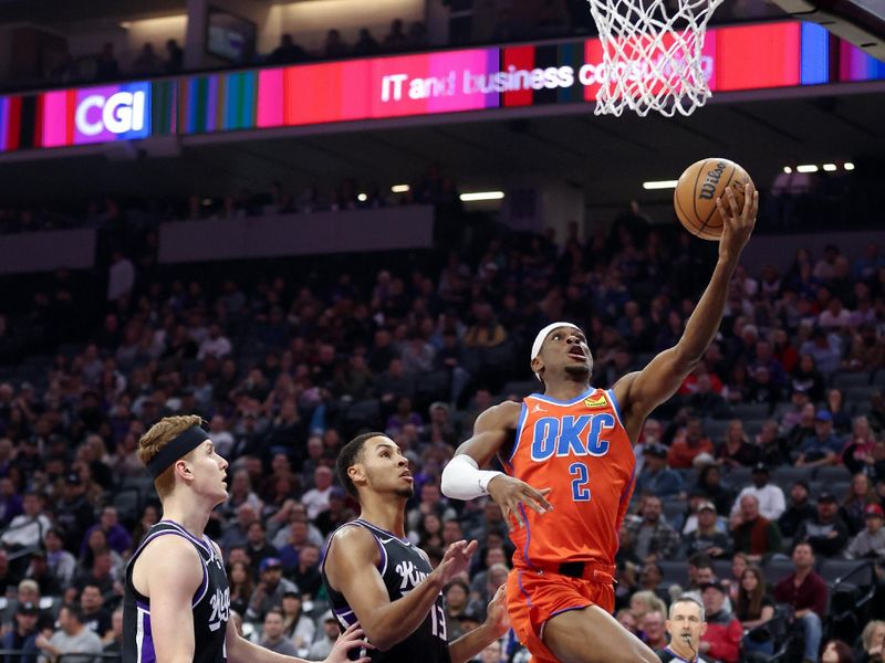 SACRAMENTO, CALIFORNIA - DECEMBER 14: Shai Gilgeous-Alexander #2 of the Oklahoma City Thunder goes up for a shot on Kevin Huerter #9 and Keegan Murray #13 of the Sacramento Kings in the first half at Golden 1 Center on December 14, 2023 in Sacramento, California. NOTE TO USER: User expressly acknowledges and agrees that, by downloading and or using this photograph, User is consenting to the terms and conditions of the Getty Images License Agreement.  (Photo by Ezra Shaw/Getty Images)