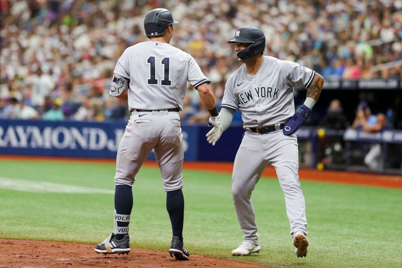 Aug 27, 2023; St. Petersburg, Florida, USA;  New York Yankees left fielder Everson Pereira (80) congratulates shortstop Anthony Volpe (11) after hitting a two run home run against the Tampa Bay Rays in the fourth inning at Tropicana Field. Mandatory Credit: Nathan Ray Seebeck-USA TODAY Sports