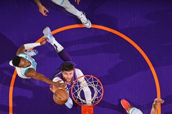 PHOENIX, AZ - DECEMBER 29: Jusuf Nurkic #20 of the Phoenix Suns drives to the basket during the game against the Charlotte Hornets on December 29 2023 at Footprint Center in Phoenix, Arizona. NOTE TO USER: User expressly acknowledges and agrees that, by downloading and or using this photograph, user is consenting to the terms and conditions of the Getty Images License Agreement. Mandatory Copyright Notice: Copyright 2023 NBAE (Photo by Barry Gossage/NBAE via Getty Images)