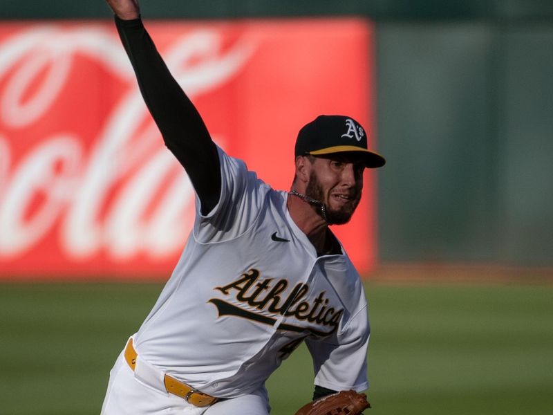 Jul 2, 2024; Oakland, California, USA; Oakland Athletics starting pitcher Mitch Spence (40) pitches against the Los Angeles Angels during the first inning at Oakland-Alameda County Coliseum. Mandatory Credit: Ed Szczepanski-USA TODAY Sports