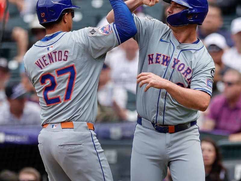 Aug 8, 2024; Denver, Colorado, USA; New York Mets third baseman Mark Vientos (27) celebrates his two run home run with first baseman Pete Alonso (20) in the fifth inning against the Colorado Rockies at Coors Field. Mandatory Credit: Isaiah J. Downing-USA TODAY Sports