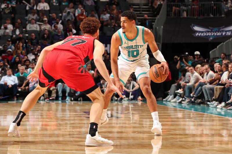 CHARLOTTE, NC - OCTOBER 30: Josh Green #10 of the Charlotte Hornets handles the ball during the game against the Toronto Raptors on October 30, 2024 at Spectrum Center in Charlotte, North Carolina. NOTE TO USER: User expressly acknowledges and agrees that, by downloading and or using this photograph, User is consenting to the terms and conditions of the Getty Images License Agreement. Mandatory Copyright Notice: Copyright 2024 NBAE (Photo by Kent Smith/NBAE via Getty Images)