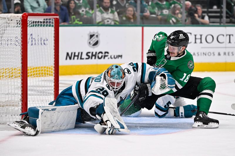 Oct 15, 2024; Dallas, Texas, USA; San Jose Sharks goaltender Mackenzie Blackwood (29) stops a shot by Dallas Stars center Sam Steel (18) during the second period at the American Airlines Center. Mandatory Credit: Jerome Miron-Imagn Images