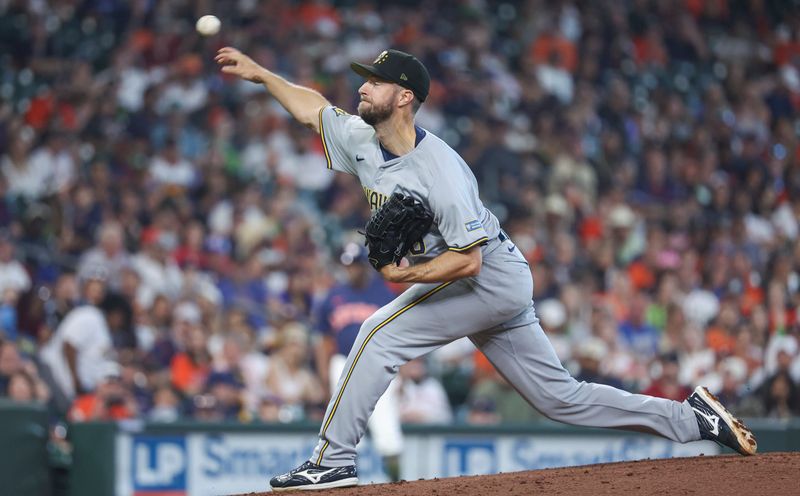 May 19, 2024; Houston, Texas, USA; Milwaukee Brewers starting pitcher Colin Rea (48) delivers a pitch during the first inning against the Houston Astros at Minute Maid Park. Mandatory Credit: Troy Taormina-USA TODAY Sports