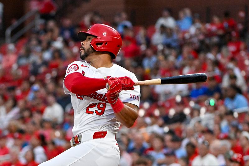 Aug 6, 2024; St. Louis, Missouri, USA;  St. Louis Cardinals left fielder Tommy Pham (29) hits a two run home run against the Tampa Bay Rays during the second inning at Busch Stadium. Mandatory Credit: Jeff Curry-USA TODAY Sports