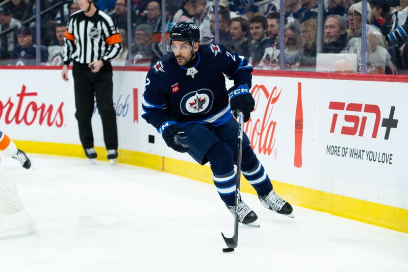 Jan 16, 2024; Winnipeg, Manitoba, CAN; Winnipeg Jets defenseman Dylan DeMelo (2) looks to make a pass against the New York Islanders during the first period at Canada Life Centre. Mandatory Credit: Terrence Lee-USA TODAY Sports