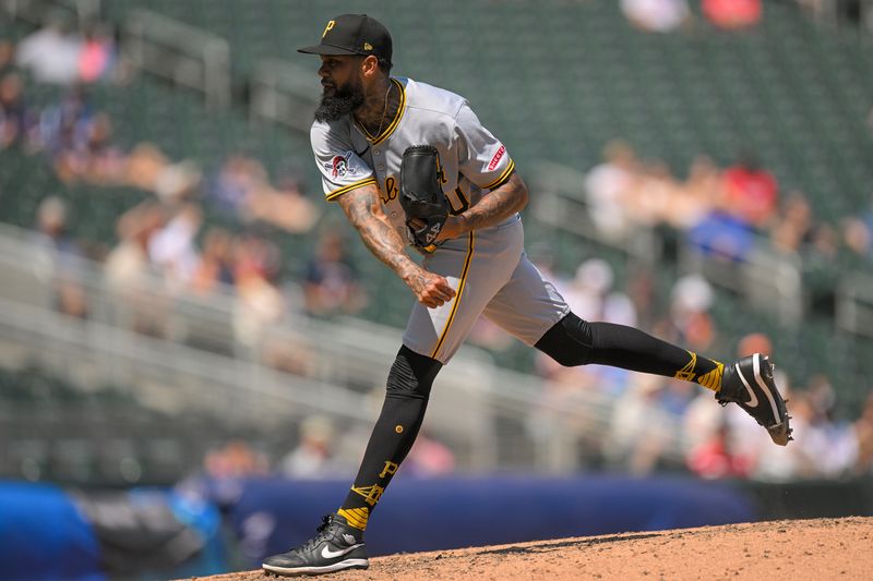 Jul 13, 2025; Minneapolis, Minnesota, USA; Pittsburgh Pirates relief pitcher Dennis Santana (60) delivers a pitch against the Minnesota Twins during the eighth inning at Target Field. Mandatory Credit: Nick Wosika-Imagn Images