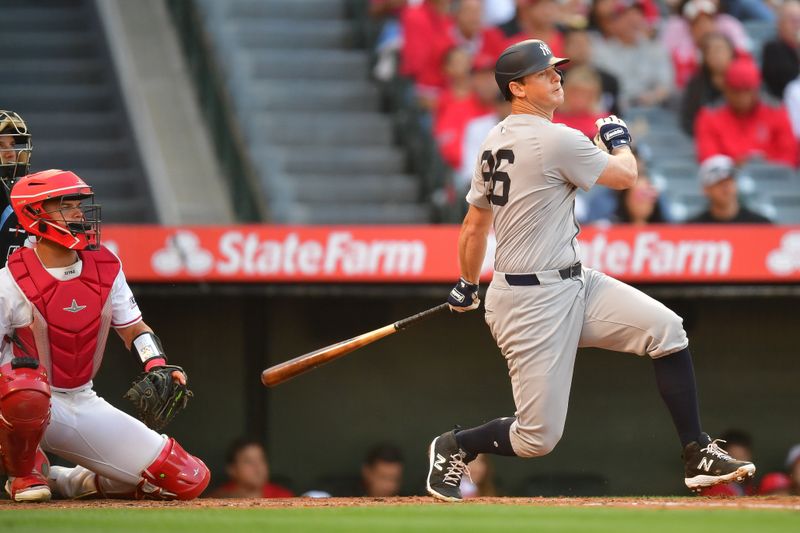 May 28, 2024; Anaheim, California, USA; New York Yankees third baseman DJ LeMahieu (26) runs out a fly ball against the Los Angeles Angels during the second inning at Angel Stadium. Mandatory Credit: Gary A. Vasquez-USA TODAY Sports