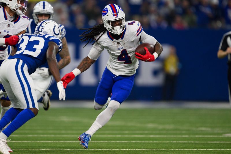 Buffalo Bills running back James Cook (4) runs dow the field during an NFL football game against the Indianapolis Colts, Sunday, Nov. 10, 2024, in Indianapolis. (AP Photo/Zach Bolinger)