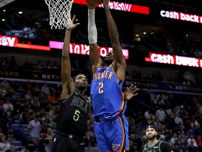 NEW ORLEANS, LOUISIANA - JANUARY 26: Shai Gilgeous-Alexander #2 of the Oklahoma City Thunder dunks the ball over Herbert Jones #5 of the New Orleans Pelicans during the third quarter of an NBA game at Smoothie King Center on January 26, 2024 in New Orleans, Louisiana. NOTE TO USER: User expressly acknowledges and agrees that, by downloading and or using this photograph, User is consenting to the terms and conditions of the Getty Images License Agreement. (Photo by Sean Gardner/Getty Images)