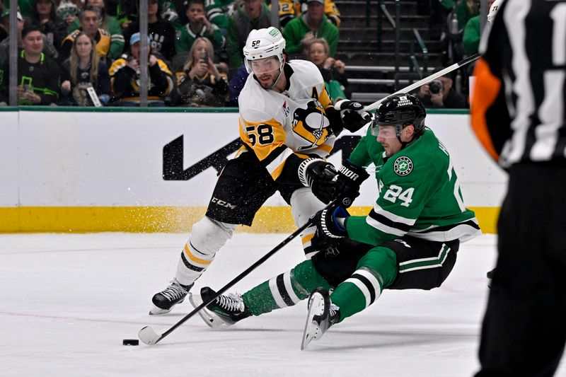 Apr 5, 2025; Dallas, Texas, USA; Dallas Stars center Roope Hintz (24) is taken down by Pittsburgh Penguins defenseman Kris Letang (58) and draws a penalty during the second period at the American Airlines Center. Mandatory Credit: Jerome Miron-Imagn Images