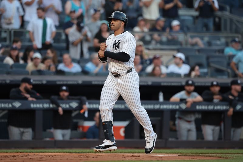 Jun 6, 2024; Bronx, New York, USA; New York Yankees center fielder Trent Grisham (12) scores after hitting a solo home run during the second inning against the Minnesota Twins at Yankee Stadium. Mandatory Credit: Vincent Carchietta-USA TODAY Sports